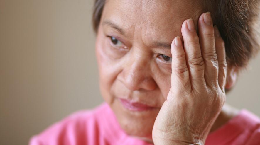 Senior woman with a worried look on her face.