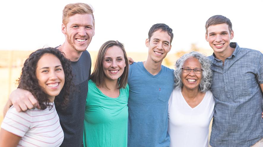 Group of people smiling together.