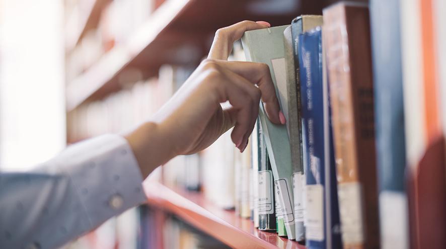 Person searching for books.