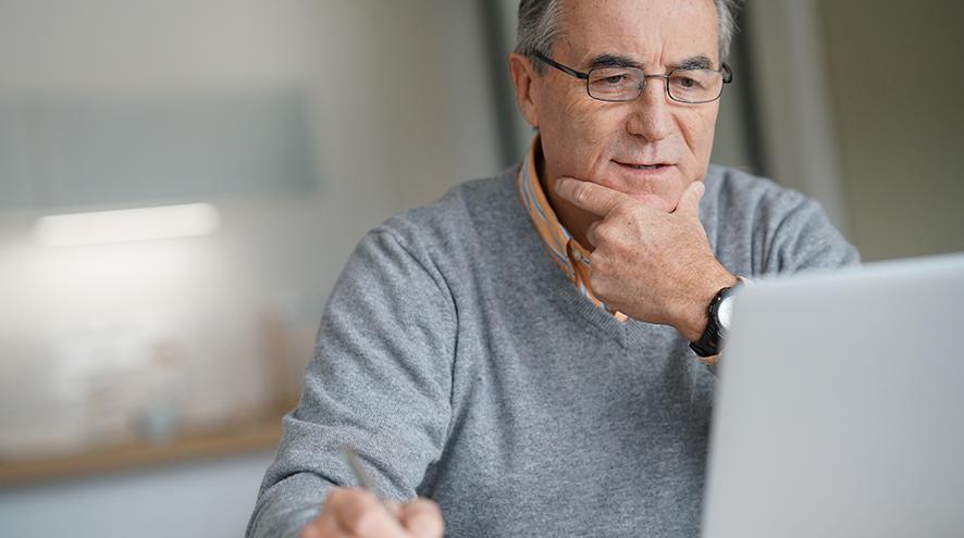 Senior man on his laptop.