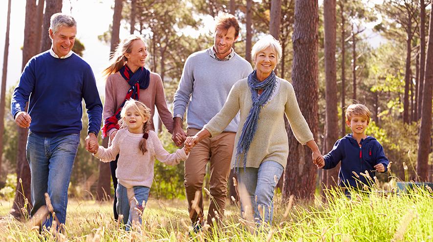 Family taking a hike through the woods.